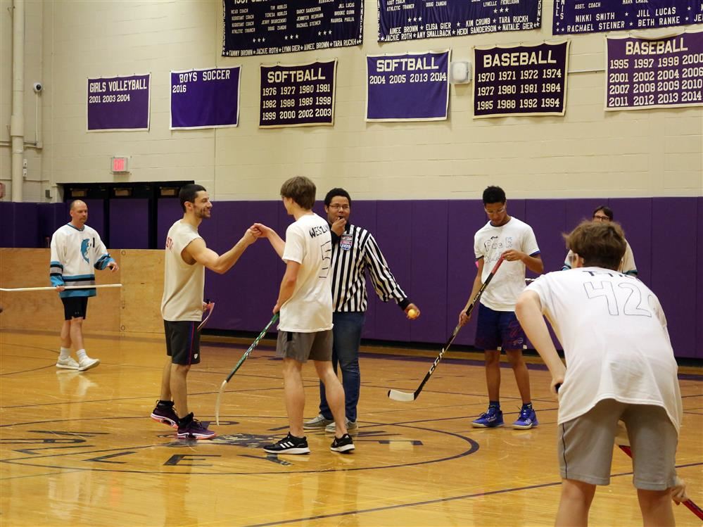  hockey players square up in the gym.